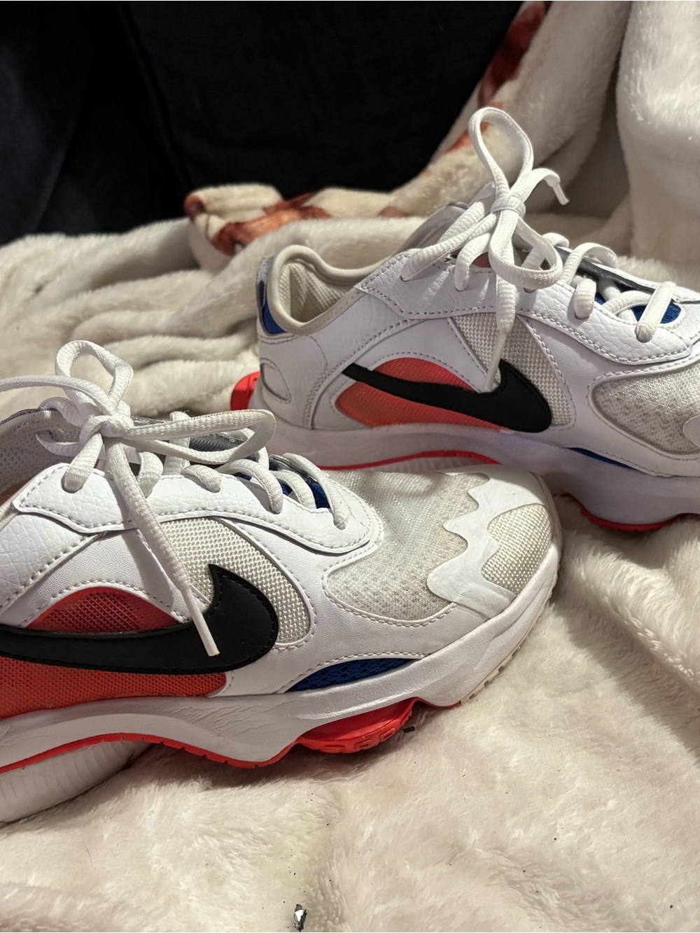 Nike White Sneakers with Black Swoosh and Red & Blue Accents